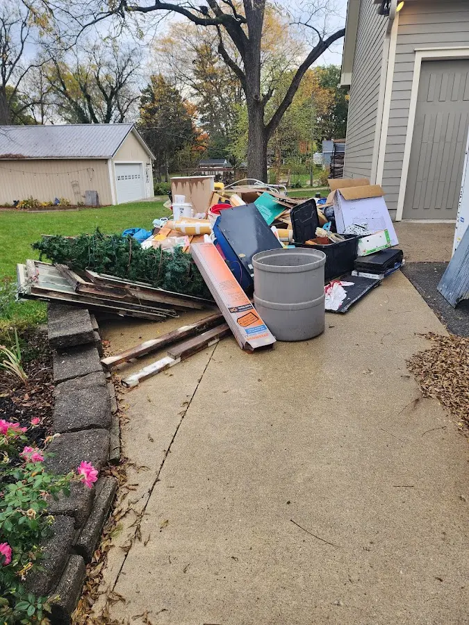 Dumpster being loaded with debris for Roofing Dumpster Rental in Poughkeepsie